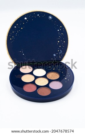 Professional pallet of eyeshadow. Multi metallic glitter coloured on the round circle container. The mock-up template on the white background.