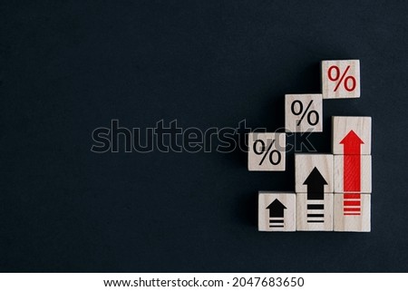 Stepped wooden blocks with percentage signs and up arrow symbols. concept of Finance and Mortgage Interest Rate Royalty-Free Stock Photo #2047683650