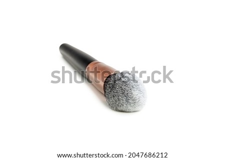 large powder brush on a white background