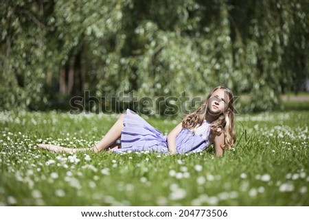 Beautiful girl at the park looking very happy 
