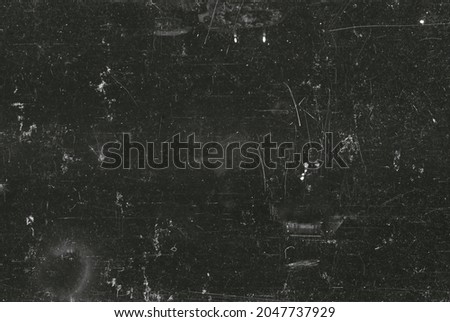 Dusty scratched grunge scanned old film texture Royalty-Free Stock Photo #2047737929