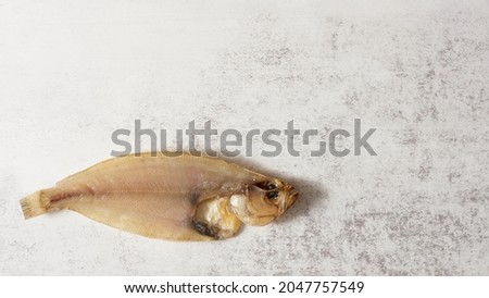dried flatfish fish on marble