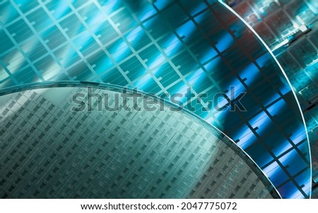 Silicon Wafer with microchips used in electronics for the fabrication of integrated circuits. Royalty-Free Stock Photo #2047775072