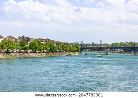 Panoramic view over turquoise Rhine river on a summer day in the centre of Basel, Switzerland