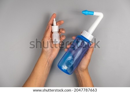 Spray and bottle for rinsing the nose Royalty-Free Stock Photo #2047787663