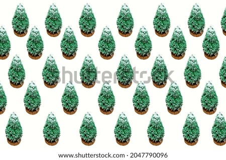 Geometric rows of Christmas trees with snow on white background