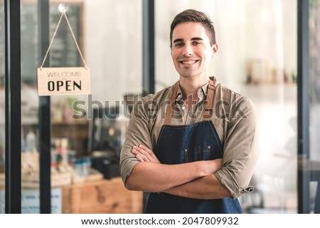 The coffee shop is open and male baristas are happy to serve you.