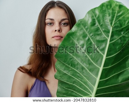 woman in swimsuit green leaf exotic isolated background model