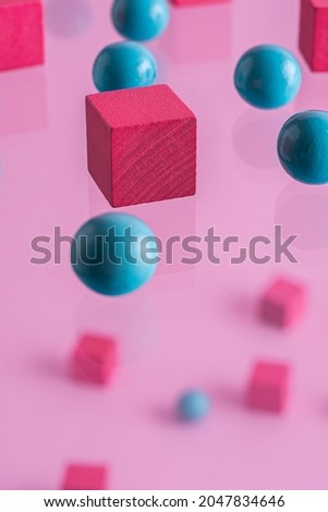  Pink boxes and blue spheres, abstract background.
