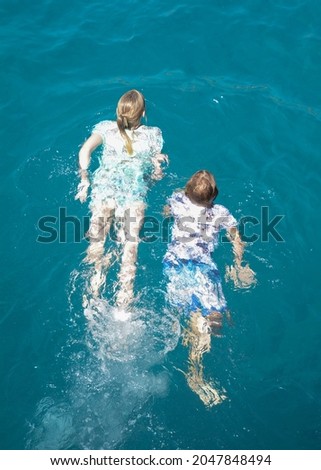 woman swimming at sea holiday 