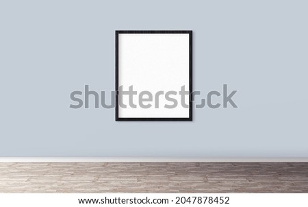 White poster with frame on light wall. Empty template.