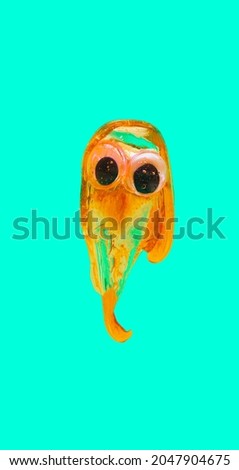 Orange slime spilling with spooky eyes against turquoise green background. Minimal fun or Halloween concept.