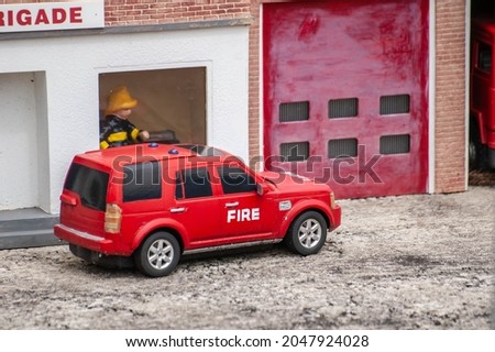Closeup of tiny model fireman at a model village