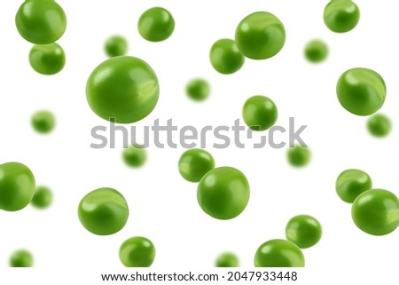 Falling green Pea, isolated on white background, selective focus Royalty-Free Stock Photo #2047933448