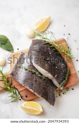 Top view of fresh halibut fish steaks on white background. Omega 3 fats source. Brain food