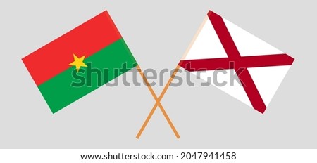 Crossed flags of Burkina Faso and The State of Alabama. Official colors. Correct proportion