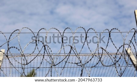 09.27.2021 wroclaw, poland, Barbed wire, razor wire on the border of Poland. Royalty-Free Stock Photo #2047963733