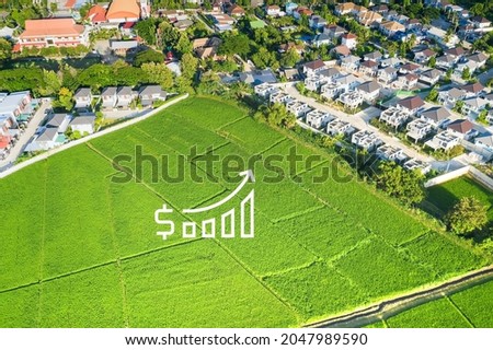 Land value in aerial view consist of landscape of green field or agriculture farm, house building, growth graph of rate market price for agent, realtor, investor to sale, buy, mortgage and investment.