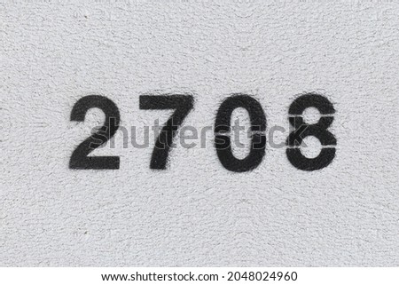 Black Number 2708 on the white wall. Spray paint. Number two thousand seven hundred and eight. Royalty-Free Stock Photo #2048024960