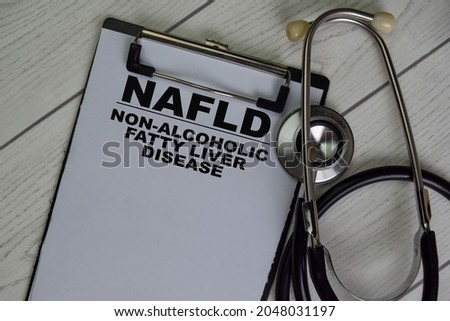 NAFLD - Non-Alcoholic Fatty Liver Disease write on a paperwork isolated on Wooden Table. Royalty-Free Stock Photo #2048031197