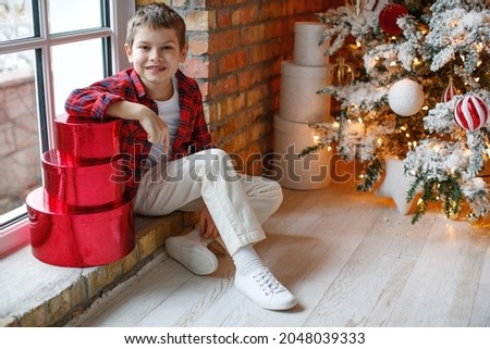 Child at Christmas. Happy child boy in a holiday. High quality photo