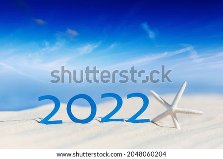 Happy New Year 2022. Abstract cean beach background photo of coming New Year 2022 and leaving year of 2021