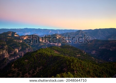 beautiful landscape at sunrise with mountains in the background and beautiful colors in the sky, foret from durango mexico sierra madre occidental Royalty-Free Stock Photo #2048064710