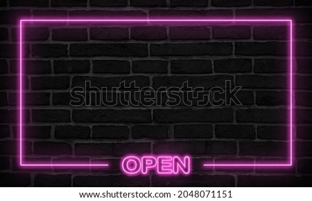 Pink neon sign on a wall
