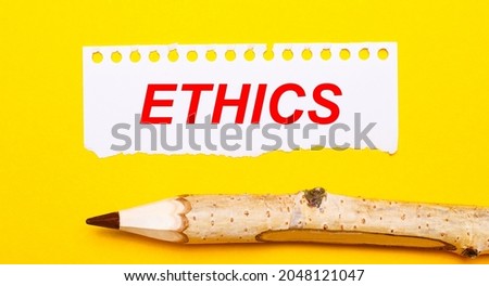On a bright yellow background, a large wooden pencil and a sheet of torn paper with the text ETHICS