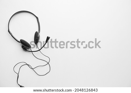 Headphones with microphone on white background Royalty-Free Stock Photo #2048126843