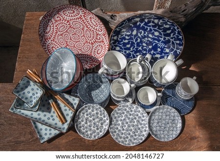 Different Ceramic Plates, Bowl and cup on wooden table. Ceramic tableware, Beautiful arrangement, No focus, specifically.