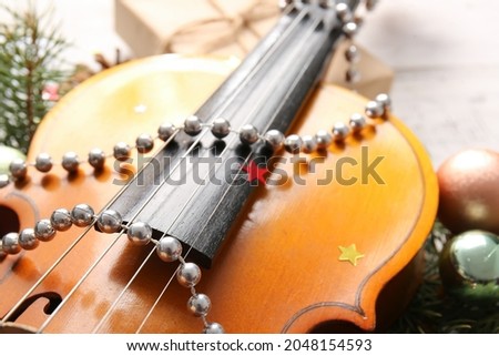Violin and Christmas decor, closeup