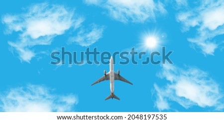 Bottom view of airplane flying . picture for stretch ceiling decoration. Airplane flying in the blue sky