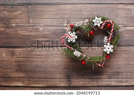 Christmas wreath on wooden background. Top view holiday photography