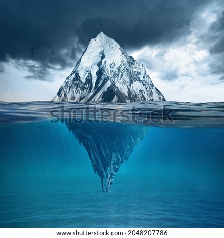 Beautiful big white iceberg mountain underwater. Concept global warming and melting glaciers. Royalty-Free Stock Photo #2048207786