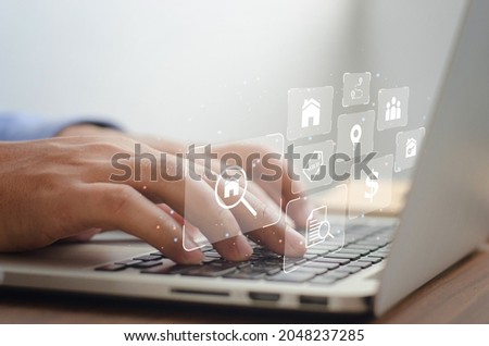 Male businessman typing computer to sell real estate and items. Brokers and Contractors residential real estate Chief Executive of Investment real estate development buy a house online Royalty-Free Stock Photo #2048237285