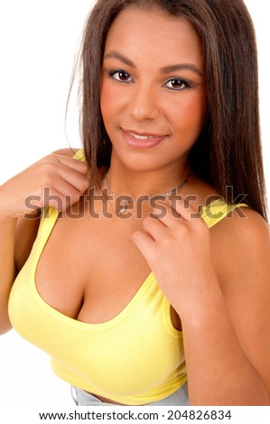 A beautiful young woman in a portrait picture holding her hands on her shoulder, isolated on white background. 