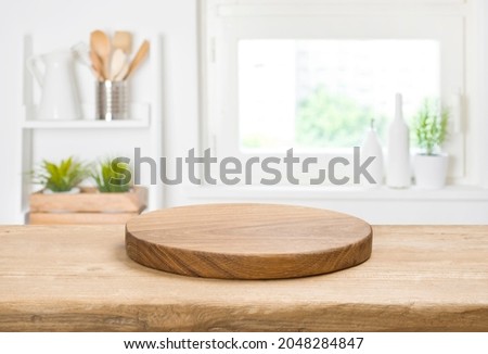 Food background concept with empty vintage cutting board on table Royalty-Free Stock Photo #2048284847