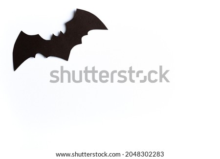Halloween concept, black bat on white background, handmade atmospheric halloween background, flay, copy space, cut out