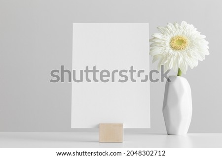 Wedding table number card mockup with a floral arrangement. Royalty-Free Stock Photo #2048302712