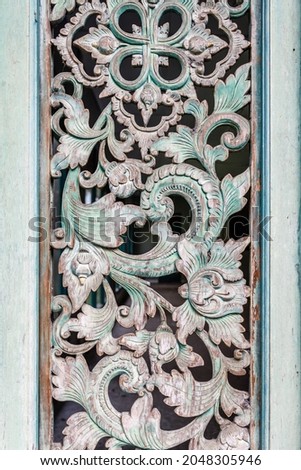Carved wooden panel, interior decoration. Bali, Indonesia.