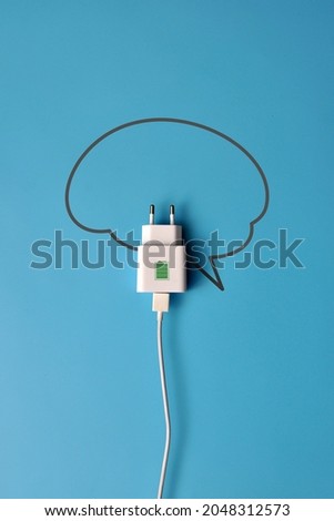 The silhouette of the brain and the plug of the socket with a picture of a battery on it. The symbol of Charging for the brain