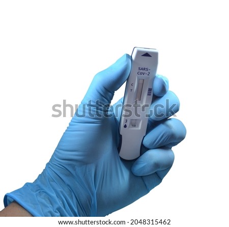 Close up of hand holding coronavirus covid-19 negative Antigen Rapid Test (ART) kit isolated on white
background, selective focus. Clipping path included.