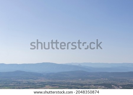 Blurred mountain landscape in blue mist color perfect for background, France, Europe
