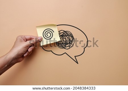 A brain silhouette with a pattern of confusion and a sticker with a pattern of clear lines. Replacing confusion in the head with clear thinking Royalty-Free Stock Photo #2048384333