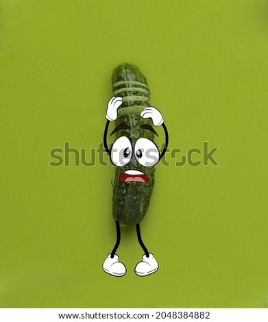 Split personality. Funny cute green cucumber shocked isolated over green background. Drawn vegetable in a cartoon style. Vitamins, vegan. Concept of funny meme emotions, healthy food concept
