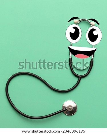 Checking heart and lungs. Contemporary art collage of phonendoscope with cartoon eyes isolated over green background. Concept of healthcare, treatment, medicine. Copy space for ad
