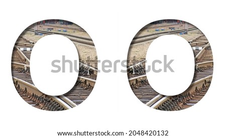 Railway font. The letter O is cut out of white paper against the background of railroad rails, mirror background for convenience. Decorative industrial alphabet.