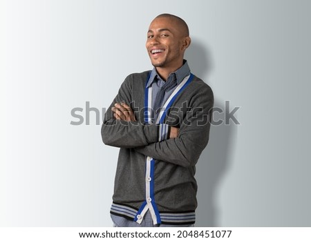 Charming friendly and polite guy in trendy t-shirt smiling