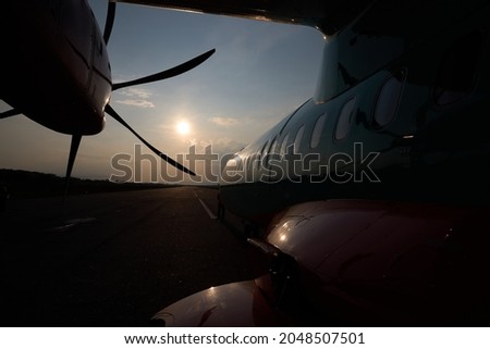 Aircraft propeller. Outside view. Sunset and plane. High quality photo Royalty-Free Stock Photo #2048507501